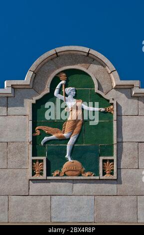 The Spirit of Progress, female figure holding a torch and a caduceus, 1930s low relief on building on Farragut Street, Laredo, Texas, USA Stock Photo