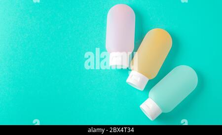 essential travel kit. toiletry kit. cosmetic bottles. small cosmetic travel containers for cream, shampoo, conditioner Stock Photo