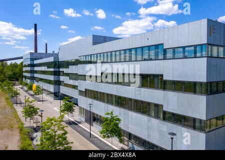 New building of the Folkwang University of the Arts, on the site of the Zollverein Coal Mine Industrial Complex in Essen, in the rear the Zollverein c Stock Photo