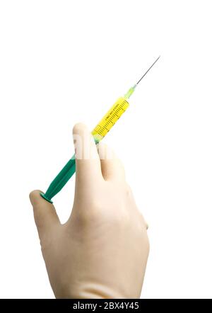 hand in beige latex glove holding a syringe filled with yellow liquid, isolated on white Stock Photo
