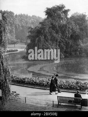 British Prime Minister Neville Chamberlain with his wife during a walk in St James Park in London before a speech in the Parliament on the crisis in European politics. Stock Photo