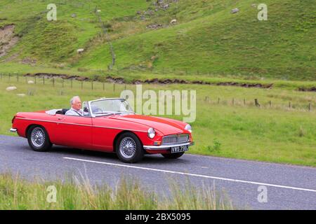 MOFFAT, SCOTLAND - JUNE 29, 2019: 1968  MG MGB Roadster Sports car in a classic car rally en route towards the town of Moffat, Dumfries and Galloway Stock Photo