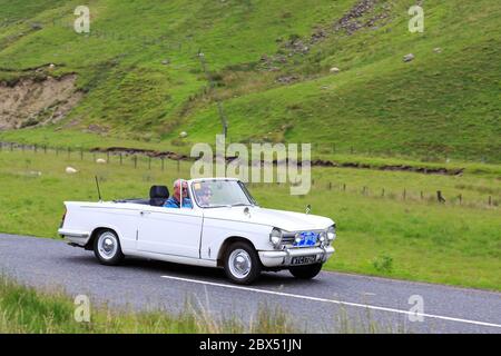 MOFFAT, SCOTLAND - JUNE 29, 2019: 1969 Triumph Herald 13/60 car in a classic car rally en route towards the town of Moffat, Dumfries and Galloway Stock Photo