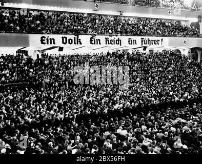 The banner 'Ein Volk, ein Reich, ein Fuehrer!' at the spectator terrace of the Sportpalast in Berlin during a rally. Stock Photo