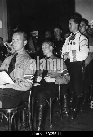 At the meeting of the National Socialist German Students' League in the Kulturvereinshaus during the speech of Reich Student Leader Gustav Adolf Scheel. On the right is a guest from Transylvania. Stock Photo