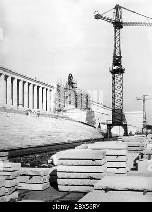 The Ehrentribuene (Tribune of Honour) on the Zeppelin Field at the Nuremberg Nazi Party Rally Grounds designed by Albert Speer, is covered with shell limestone slabs with the help of construction cranes. Stock Photo