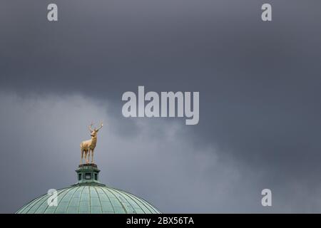 05 June 2020, Baden-Wuerttemberg, Stuttgart: Black clouds move in the sky behind a deer figure on the building of the Württembergischer Kunstverein. Photo: Tom Weller/dpa Stock Photo