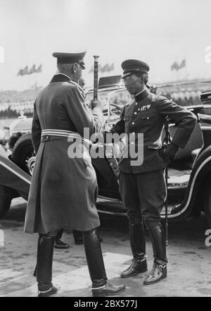 Field Marshal Werner von Blomberg welcomes Prince Chichibu Yasuhito, brother of the Emperor of Japan and General of the Japanese Army, as guest on the Day of the Wehrmacht during the Reich Party Conference of Labor in Nuremberg. Stock Photo