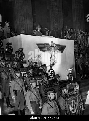 Reich Minister Dr. Goebbels during his speech at a mass rally in the Berlin Lustgarten. In front of the lectern are SA men with their standards. Stock Photo