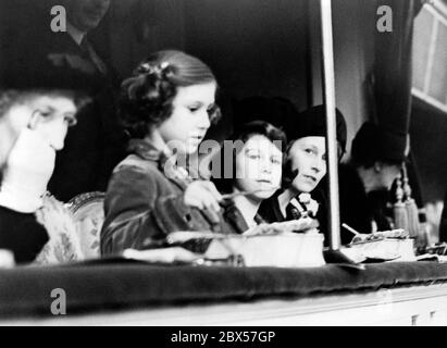 Princess Margaret (standing) with her sister Princess Elizabeth (3rd from left) at the National Pony Show at the Royal Agricultural Hall in Islington. Stock Photo