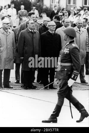 The commander of the honorary formation of the People's Army parades in front of the GDR State Council Chairman Erich Honecker and the Soviet party leader Leonid Brezhnev on his arrival at the airport Berlin-Schoenefeld on May 12, 1973. From left to right: GDR Prime Minister Willi Stoph, Leonid Brezhnev, Erich Honecker, Union head Harry Tisch and SED Politburo member Horst Dohlus. Stock Photo