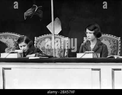 Elizabeth II and her sister Princess Margaret Rose (left) are attending the National Pony Show at the Royal Agriculture Hall in Islington, London. Stock Photo