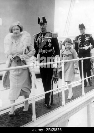 From left to right: Queen Elizabeth, King George VI: and Crown Princess Elizabeth II on board the royal yacht 'Victoria and Albert' during the Coronation Review of the British and Merchant Navy at Spithead. More than 300 ships took part in the Fleet Parade, 17 of them were foreign warships. Stock Photo