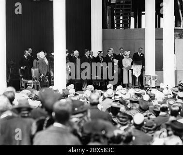 Queen Elizabeth gives her first and only speech at the groundbreaking ceremony for the new Supreme Court building in Ottawa during her tour of Canada and the USA. To her left is Lord Tweedsmuir, the Governor General of Canada and King George VI. Stock Photo