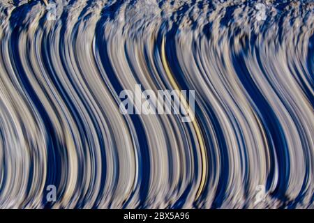 pattern of curves and lines of grey and blue making a pattern Stock Photo