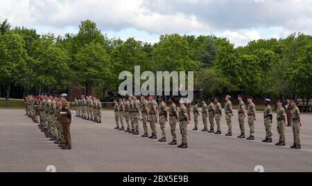 Recruits are inspected during a passing out parade at Sir John Moore Barracks, Winchester, the first batch of soldiers to complete their training in the Army Training Regiment (Winchester) since the coronavirus lockdown. Stock Photo