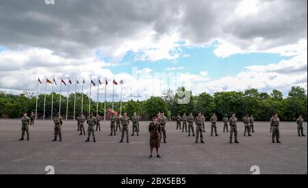 Recruits are inspected during a passing out parade at Sir John Moore Barracks, Winchester, the first batch of soldiers to complete their training in the Army Training Regiment (Winchester) since the coronavirus lockdown. Stock Photo