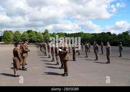 Recruits are inspected during a passing out parade at Sir John Moore Barracks, Winchester, the first batch of soldiers to complete their training in the Army Training Regiment (Winchester) since the coronavirus lockdown. Stock Photo