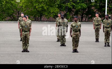 Recruits are inspected during a passing out parade at Sir John Moore Barracks, Winchester, the first batch of soldiers to complete their training in the Army Training Regiment (Winchester) since the coronavirus lockdown. Stock Photo