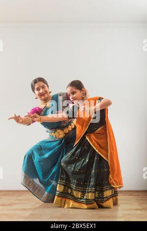 Young bharatnatyam dancer learning from her teacher. Stock Photo