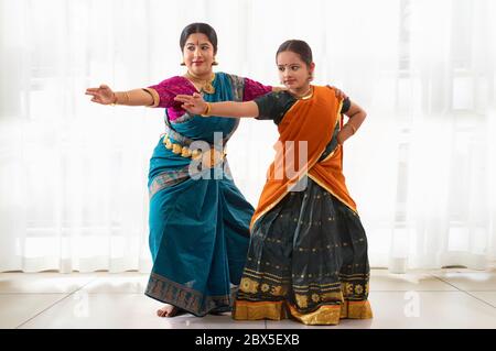 Young bharatnatyam dancer learning from her teacher. Stock Photo