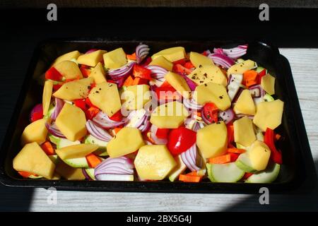slices of young potato with pepper prepare for dinner time Stock Photo