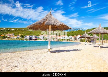 Adriatic sea shore in Croatia on Pag island, parasol on beautiful Puntica sand beach Stock Photo