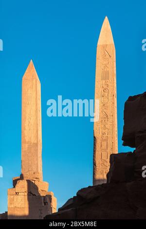 Two obelisks at sunset in Karnak Temple complex in Luxor, Egypt Stock Photo