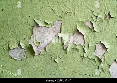 Close up of old stucco cracks on the wall. Weathered paint cracks on plaster. Cracked wall background. Abstract Web Banner Stock Photo