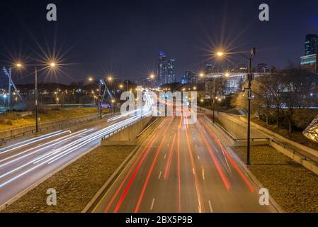 Chicago, USA - December 16, 2017: Columbus Drive at night full of car light streaks shot with long exposure motion blur effect ( for editorial use onl Stock Photo