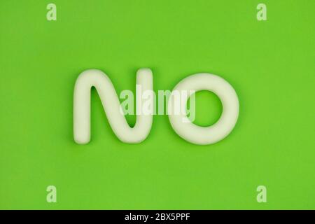 No. Message of refusal on green background, 3d model. Oposition, resist, denial concept. Negative reaction. Stock Photo