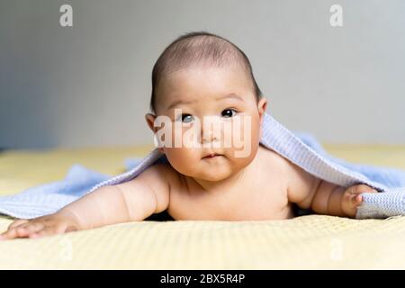 Funny Newborn Boy Was Lying Under A Soft Blanket Stock Photo Alamy