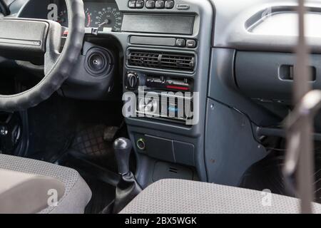 Novosibirsk, Russia - 05/20/2020: central control console in black plastic with Pioneer radio in the passenger compartment of an old Russian car brand Stock Photo