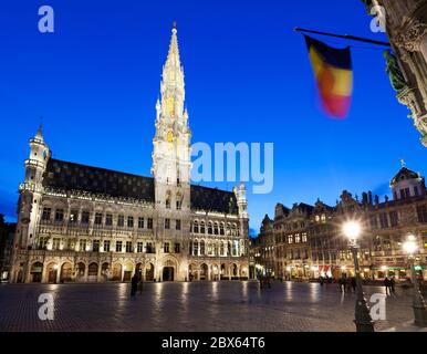 Hotel de Ville and guildhouses in the Grand Place (main Square) at dusk Stock Photo