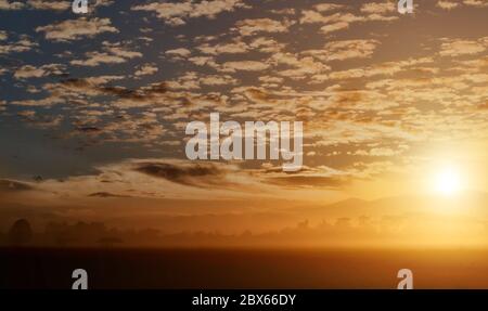 Countryside landscape under scenic colorful sky with cloud at sunset background. Stock Photo
