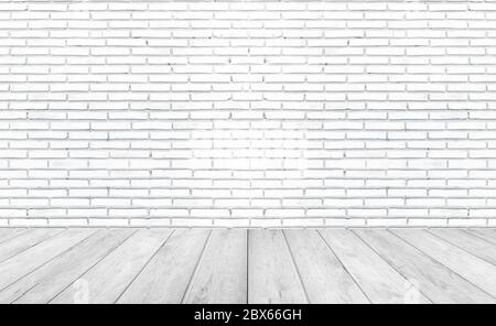 White empty wooden floors with brick wall background. Studio or office blank space. Stock Photo