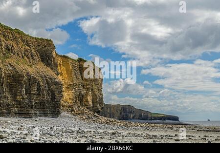 The cliffs looking east Llantwit Major beach on the Glamorgan Heritage Coast south Wales. The remains of a rockfall can clearly be seen in the shot. Stock Photo