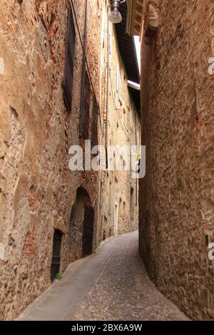 Empty narrow medieval street in Bergamo, Lombardy, Italy Stock Photo