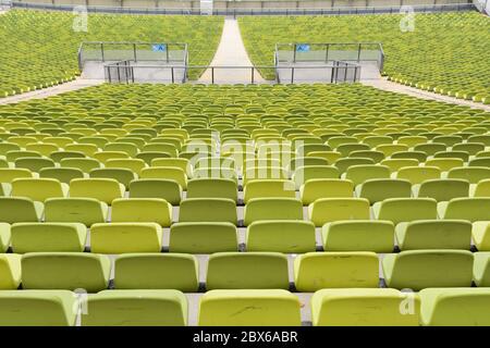 Green chairs in Olympiastadium in Munich Stock Photo