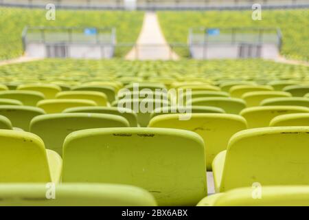 Green chairs in Olympiastadium in Munich Stock Photo