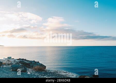 Looking out at sea during sunrise Stock Photo