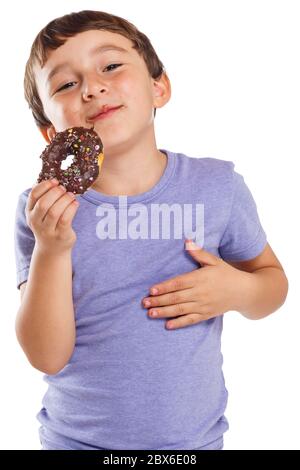 Young boy child eating donut unhealthy sweet sweets isolated on a white background Stock Photo