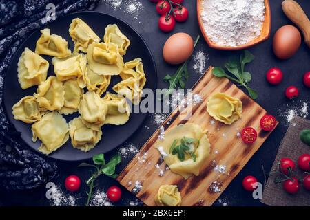 Preparation of Italian pasta with ingredients. Gastronomic concept Stock Photo