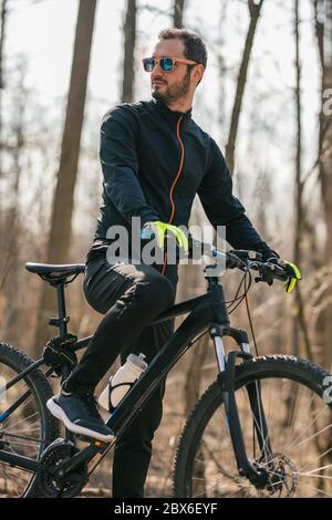 Portrait of young cyclist resting Stock Photo