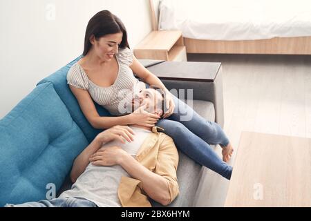 Lovely newlyweds resting and relaxing at home together Stock Photo