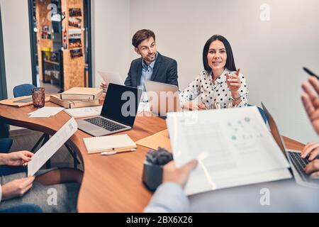 Business people discussing new contract with boss in office Stock Photo