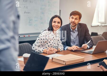 Managers discussing possibility of cooperation with partners Stock Photo