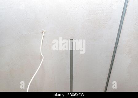 Aluminum profile for LED lighting placed in the ceiling in a newly built house. Stock Photo