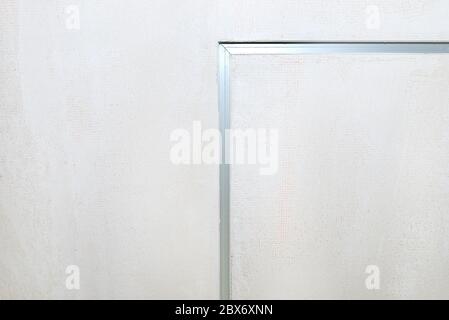 Aluminum profile for LED lighting placed in the ceiling in a newly built house. Stock Photo