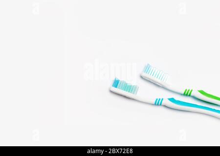 New different colored toothbrushes on a white background Stock Photo
